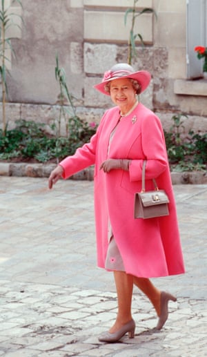 The Queen always had an innate understanding of how her wardrobe could add visual interest to her appearances. She knew this was helpful on the ground, in making herself a focal point by which onlookers straining to catch a glimpse could instantly make sense of a crowded scene. And she knew, also, that it helped make a great photograph. There is a lovely playfulness to this outfit, designed by Ian Thomas for a visit to Blois in France in 1992. The unstructured coat is unusually soft in silhouette, while the pink flowers glimpsed on the dress seem to wink to the flowers on the hat.