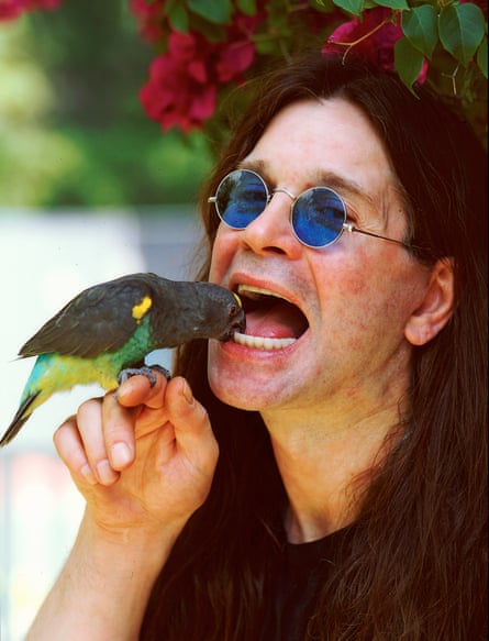 Ozzy Osborne with a parakeet in his Beverly Hills home in March 1997.