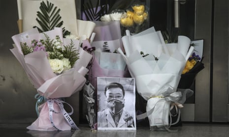 A portrait of Dr Li Wenliang is left at his workplace in Wuhan.