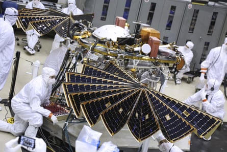Technicians inspect the InSight lander’s solar arrays before launch.