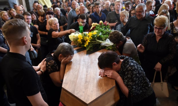 Mourners at a Ukrainian serviceman’s funeral in the western city of Lviv amid Russia’s continuing invasion
