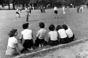 Local Brazilian girls watch the England team training for their opening match, against Chile