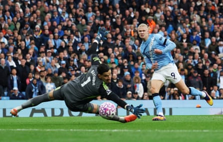 Erling Haaland scores past Manchester United’s Altay Bayindir in the derby victory for City.
