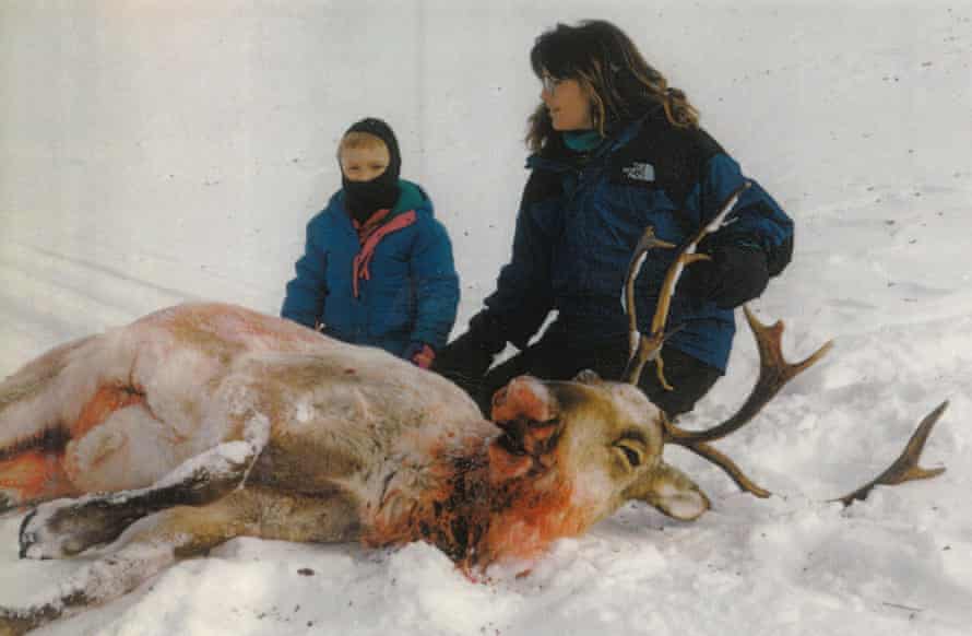 Sarah Palin poses with one of her daughters and a caribou she shot in Alaska.