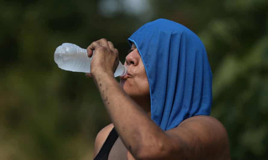 A woman drinks water duing the heatwave that hit Salem, Oregon on 12 August.