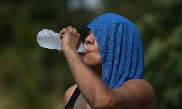 A woman drinks water duing the heatwave that hit Salem, Oregon on 12 August. 