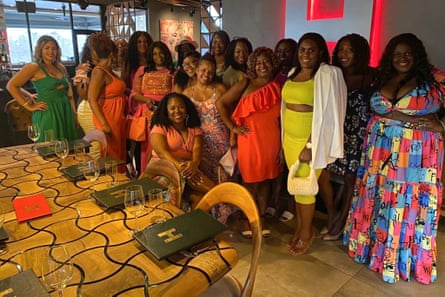 women stand together for a photograph