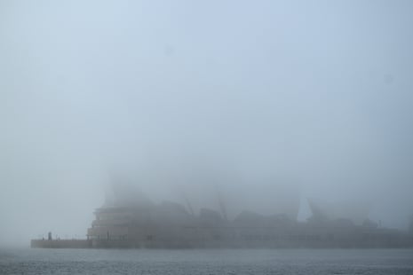 A building shrouded in thick fog.