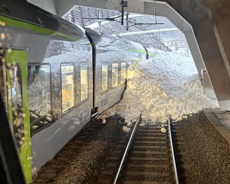 Train derails in Switzerland amid fatal avalanches across the Alps | Avalanches | The Guardian
