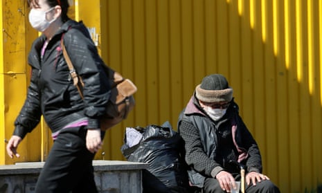 A homeless Ukrainian man begs for money on Monday during a partial lockdown in Kiev.