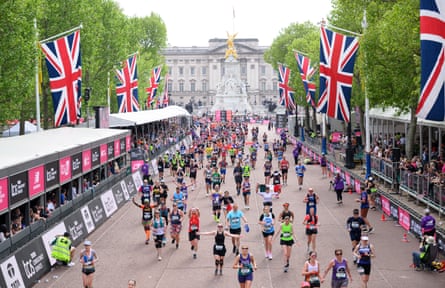Runners approach the finish line on the Mall during last year’s London Marathon