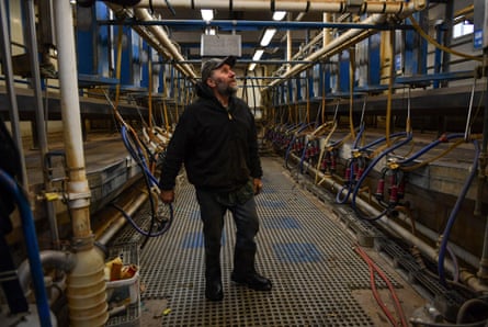 Fifth generation farmer Bob Krocak, stands inside the milking parlor as it was left when his family shut down the dairy business in 2018, Montgomery, Minnesota, March 2019