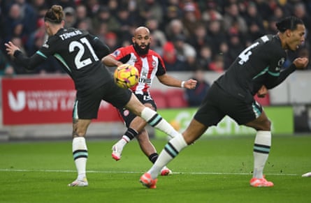 Brentford’s Bryan Mbeumo shoots as Liverpool’s Kostas Tsimikas and Liverpool’s Virgil van Dijk try to block his shot in January 2025