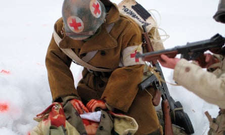 A medic struggles to save a wounded comrade.