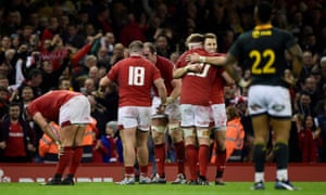 Wales’ Liam Williams and Aaron Wainwright celebrate their victory.