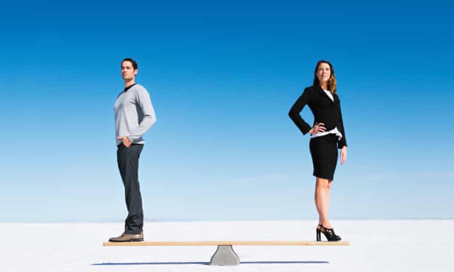 A businesswoman and businessman on a seesaw