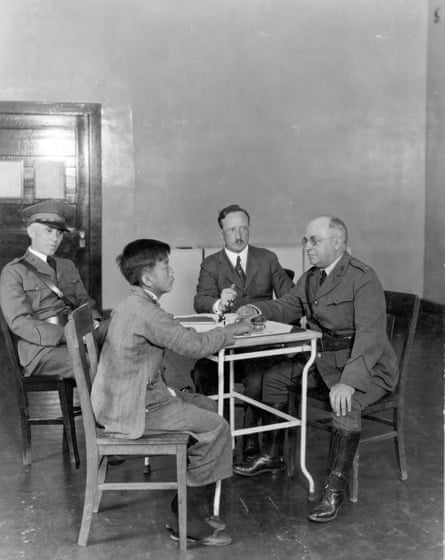 A young man is interviewed by another man