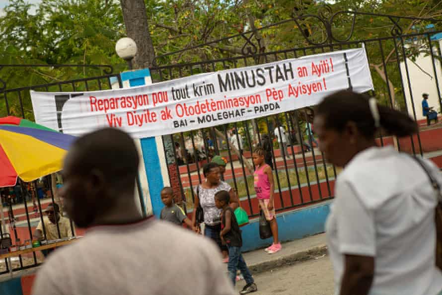 A sign strung in Mirebalais calls for reparation for the ‘crimes’ of the UN in Haiti