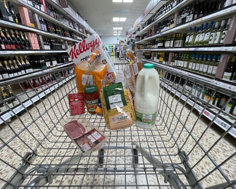 Supermarket Food Prices Increase Due To Cost of LivingNORTHWICH, ENGLAND - JULY 06: In this photo illustration a small selection of essential items sits in a shopping trolley on July 06, 2022 in Northwich, England. The British Retail Consortium recently said food manufacturers and supermarkets are having to pass on some of the cost of soaring raw materials to consumers, leading to the price of basic goods throughout the UK rising at the fastest pace since September 2008. Fresh food prices increased by 6% in the year to June 2022 coupled with an increase in inflation, and fuel and energy prices to create a cost of living crisis. This is leading to millions of low-income households going without essentials items, falling behind on bills and taking on debt. (Photo illustration by Christopher Furlong/Getty Images)