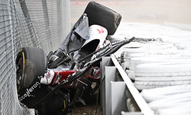 Alfa Romeo’s Chinese driver Zhou Guanyu is seen in the crash barriers during an incident at the start of the Formula One British Grand Prix at Silverstone on July 3, 2022.