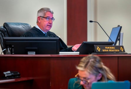 judge speaks into microphone during court