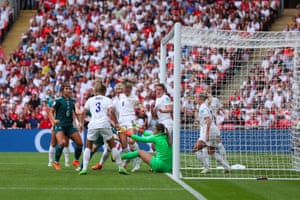 Mary Earps makes a save after a mad goal-line scramble in the England box.