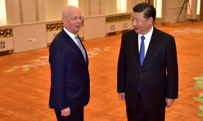 World Economic Forum head Klaus Schwab (left) is welcomed by Chinese President Xi Jinping (right) at the Great Hall of the People in Beijing.