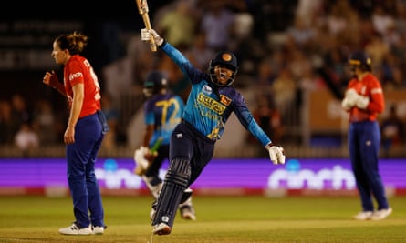 Harshitha Samarawickrama celebrates after hitting the match-winning boundary.