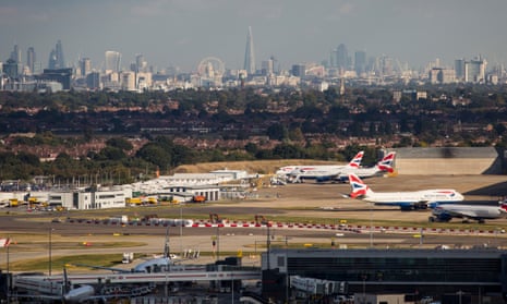 A general view of aircraft at Heathrow airport in front of the London skyline.