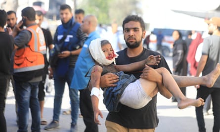 Palestinians wounded in Israeli attacks are brought to al-Ahli Arab hospital in Gaza City on Sunday.