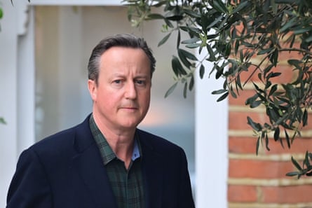 David Cameron leaves his house looking pensive