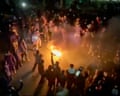 Iran protests shown in a still image taken from footage circulating on social media shows protesters dancing and cheering around a bonfire in Tehran on 9 January. Follow for the latest developments in live.