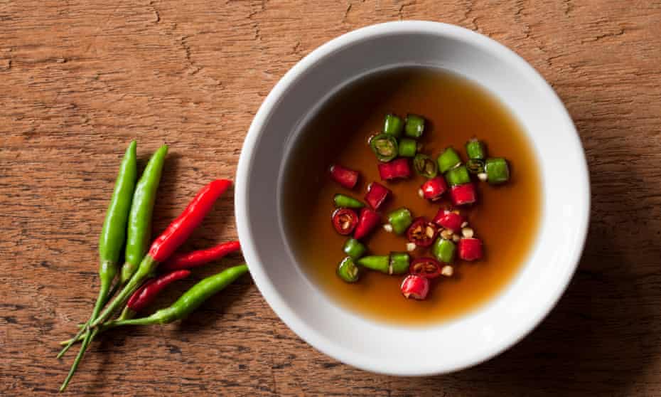 Thai red and green chili in bowl of fish sauce.A high quality version of Phrik Nam Pla – chilli in fish sauce – is the mark of a great Thai restaurant