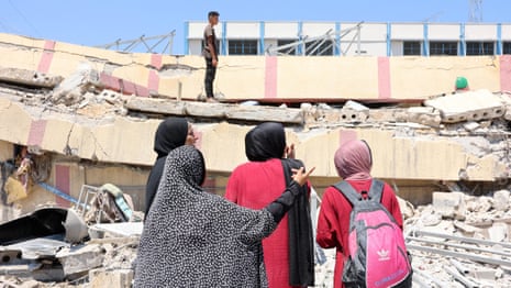 Rescuers sift through rubble after deadly airstrike on Gaza school – video