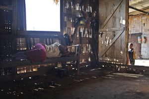 Awan, whose 23-year-old twin sons were killed by Indian army soldiers, lies on a bench inside the kitchen at her home in the north-east Indian state of Nagaland.