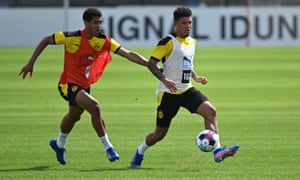Jadon Sancho, right, and Jude Bellingham compete for possession during a Borussia Dortmund pre-season training session earlier this month