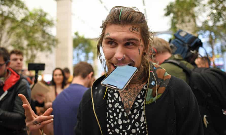 Marco Pierre White Jr holds his new iPhone X outside the Apple Store on Regent Street, London.