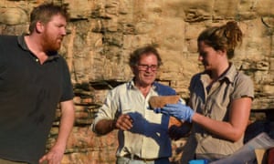 Team leader Chris Clarkson with Richard Fullagar and Elspeth Hayes examining a rare grindstone from the lowest layers of the excavation at Madjedbebe rock shelter.