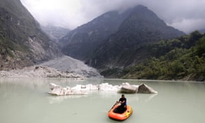 Jagan handles the pack raft on the glacier lake, Nepal