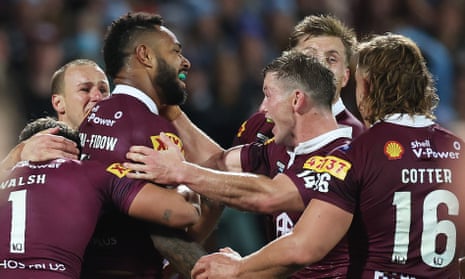 Maroons celebrate a try.