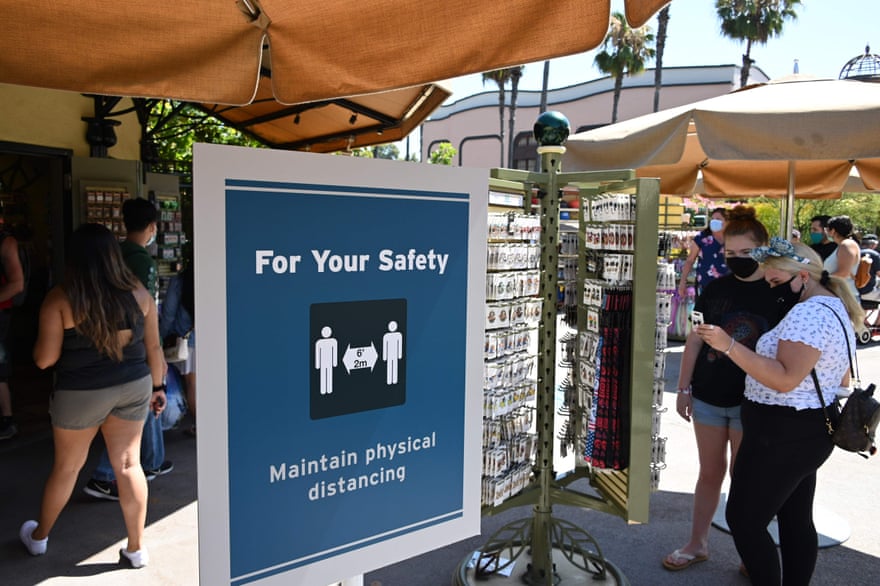 New safety measures remind Downtown Disney visitors to social distance while shopping.