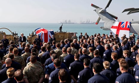 Theresa May addresses sailors on deck of HMS Ocean in Manama.
