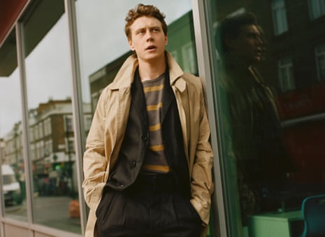 George MacKay, actor, leaning against a shop window, January 2020