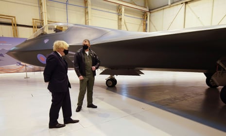 Boris Johnson looks at the Tempest fighter aircraft during a visit to BAE Systems at Warton aerodrome near Preston.
