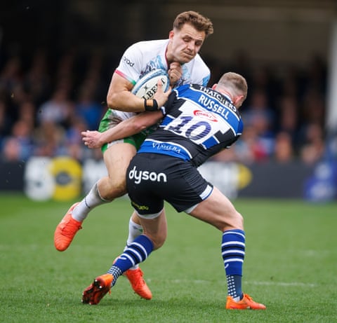 Finn Russell, who was supreme in attack, puts in the defensive work against Quins’ Oscar Beard.