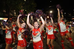 Members of the Sydney Swans football club take part in the parade.