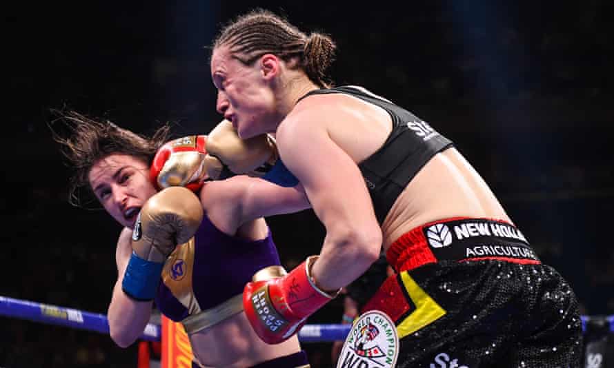 Katie Taylor (left) and Delfine Persoon trade blows during their undisputed world lightweight title fight at Madison Square Garden in June 2019.