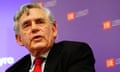 Gordon Brown speaking at a podium