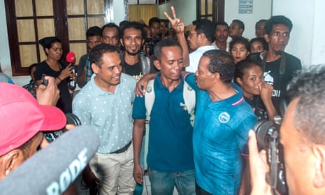 Reporter Raimundos Oki (centre) after his hearing in Dili, Timor-Leste.