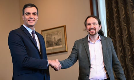 Pedro Sánchez (left) and Pablo Iglesias, leader of Unidas Podemos, shake hands during a press conference in Madrid